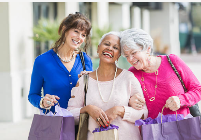 Three mature women laughing together on an afternoon out